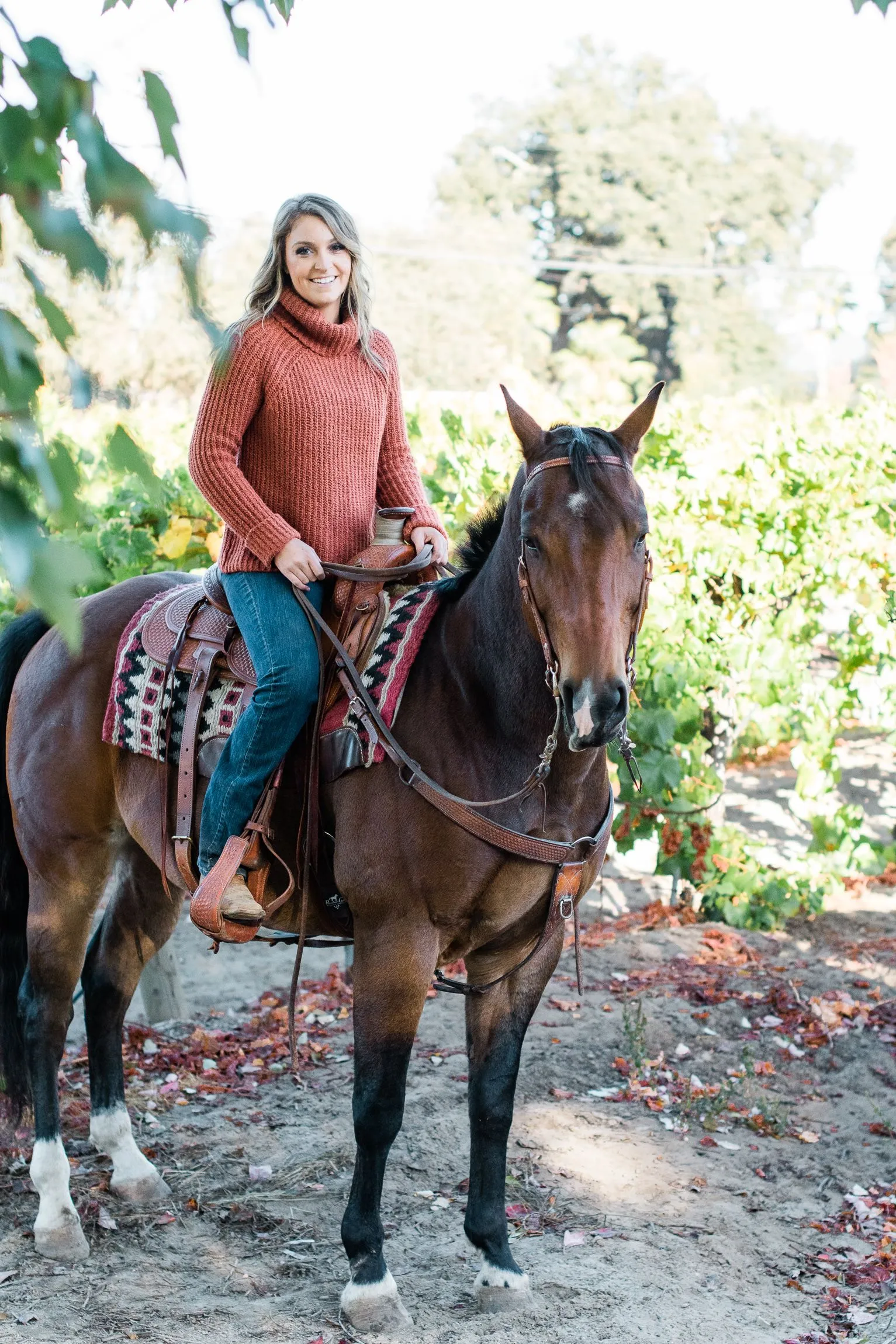 Kyndall riding a brown horse