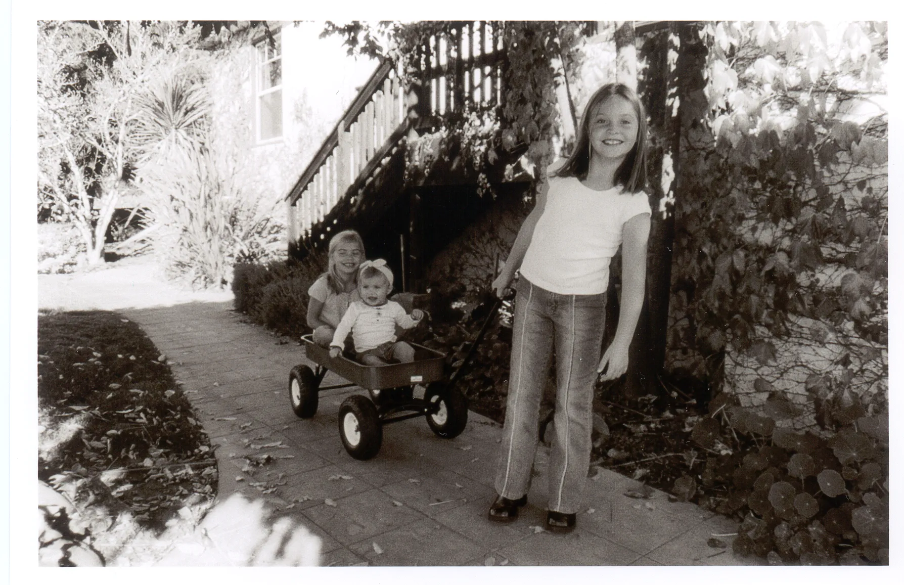 Dutton Estate Old Film photo of Kids pulling a wagon